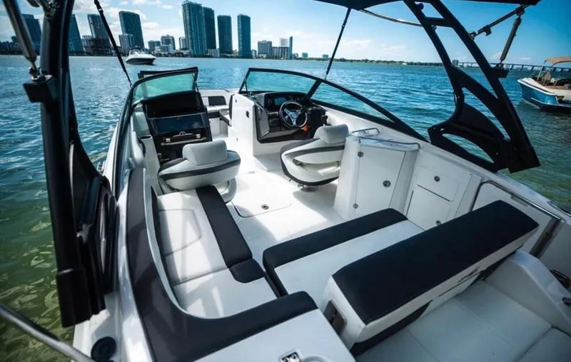 Slide: The Image of 2020 Monterey M45 boat interior with city skyline in the background. - 2