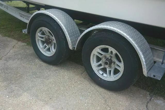 Slide: The Image of Trailer wheels for 2014 Sea Fox 226 Commander boat on concrete surface. - 11