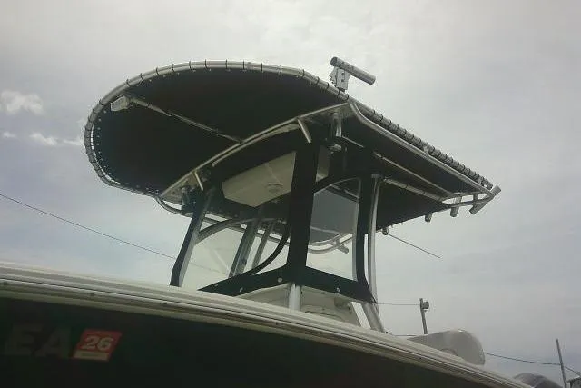 Slide: The Image of 2014 Sea Fox 226 Commander boat with T-top under cloudy sky. - 14