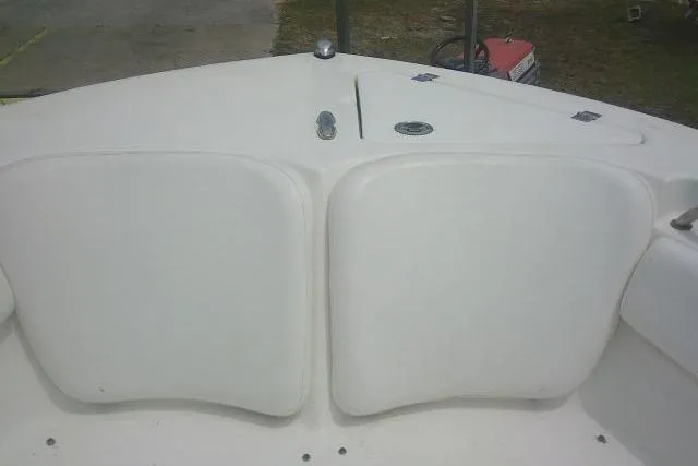 Slide: The Image of 2014 Sea Fox 226 Commander boat bow seating area with white cushions. - 16