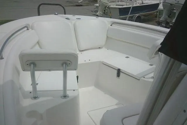 Slide: The Image of 2014 Sea Fox 226 Commander boat interior with white seating and storage compartments. - 17
