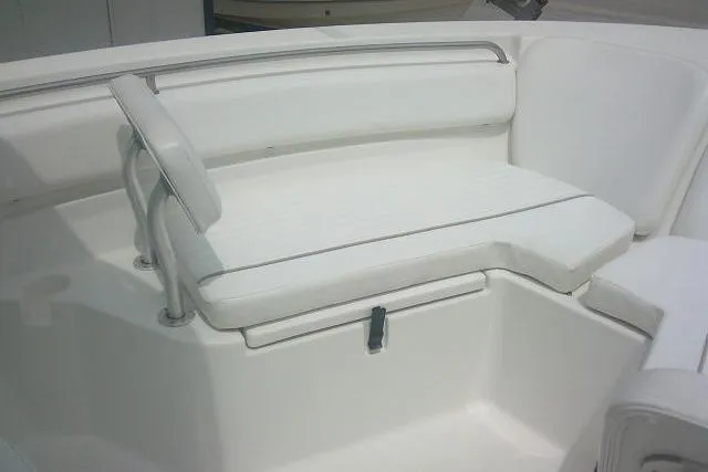 Slide: The Image of 2014 Sea Fox 226 Commander boat seating area with white cushioned bench. - 24