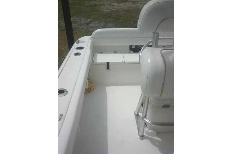 Slide: The Image of 2014 Sea Fox 226 Commander boat interior with seating and rod holders. - 25