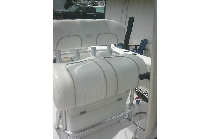 Slide: The Image of 2014 Sea Fox 226 Commander boat seating with rod holders and storage. - 26