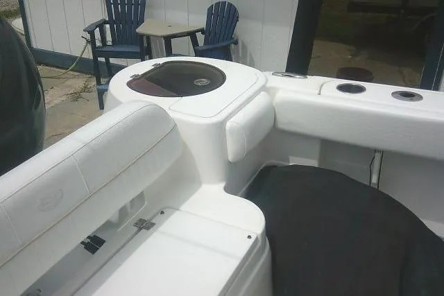 Slide: The Image of 2014 Sea Fox 226 Commander boat interior with seating and storage compartments. - 28