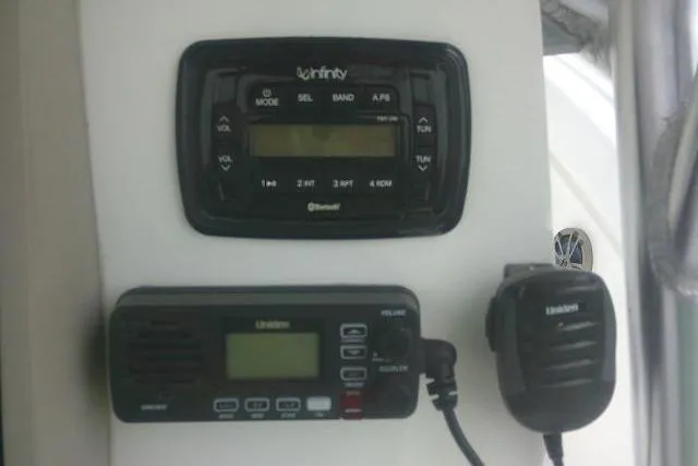 Slide: The Image of Control panel on a 2014 Sea Fox 226 Commander boat with radio and microphone. - 32