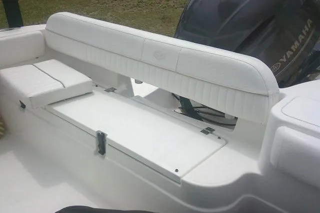 Slide: The Image of 2014 Sea Fox 226 Commander boat interior with white seating and Yamaha engine. - 35