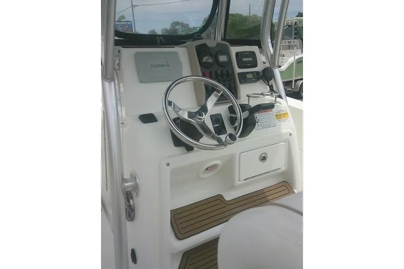 Slide: The Image of 2014 Sea Fox 226 Commander boat console with Garmin navigation system and steering wheel. - 37