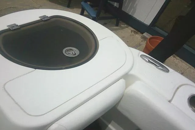 Slide: The Image of 2014 Sea Fox 226 Commander boat deck with storage compartment. - 43