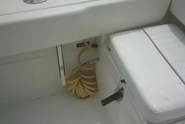 Slide: The Image of 2014 Sea Fox 226 Commander boat interior with coiled hose and seating. - 44