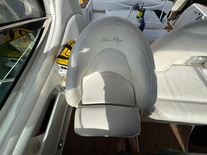 Slide: The Image of White leather seat on 2002 Sea Ray 360 Sundancer boat deck. - 16