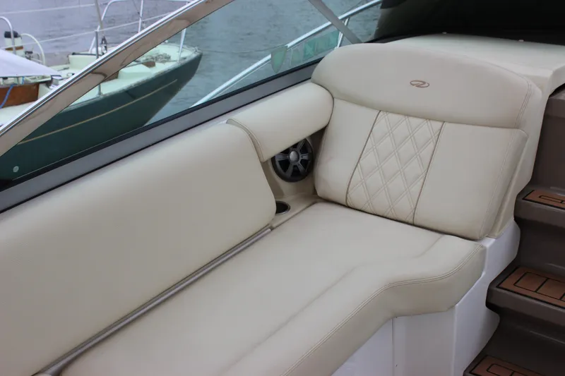 Slide: The Image of Luxurious seating on 2018 Regal 33 Express boat with diamond-stitched upholstery. - 12
