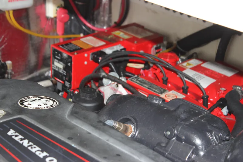 Slide: The Image of Engine compartment of 2018 Regal 33 Express boat with visible components and wiring. - 17