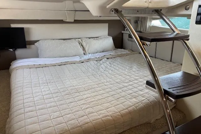 Slide: The Image of Luxurious 2018 Regal 33 Express cabin with cozy bed and modern interior design. - 33