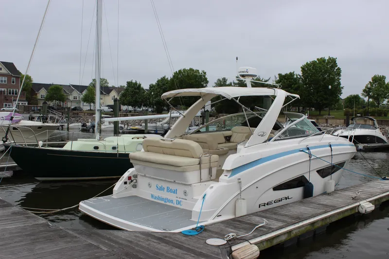 Slide: The Image of 2018 Regal 33 Express boat docked in Washington, D.C. marina. - 4