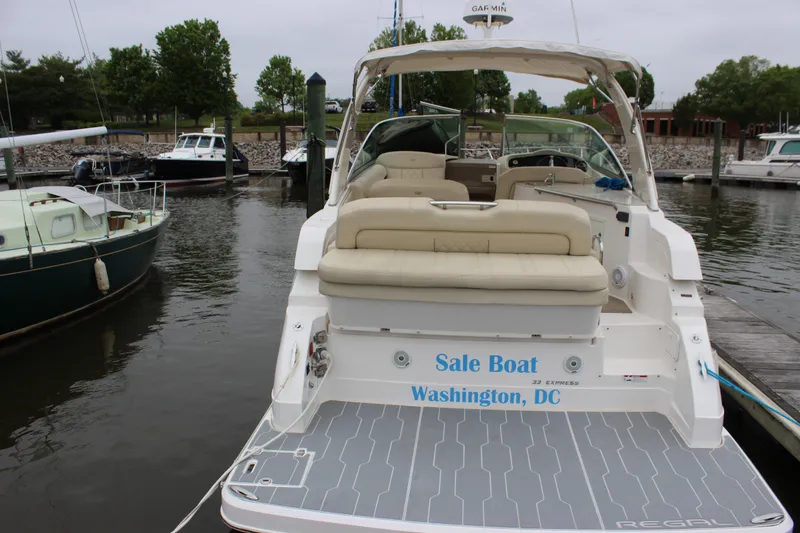 Slide: The Image of 2018 Regal 33 Express boat docked in Washington, DC marina. - 6