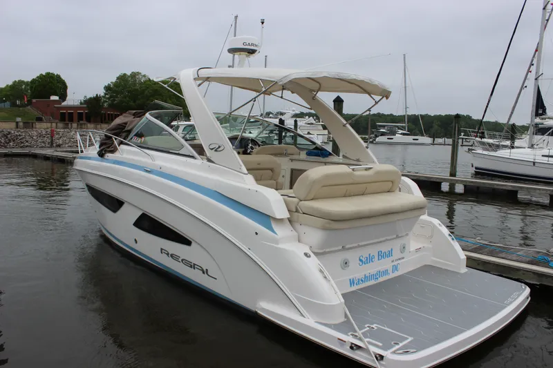 Slide: The Image of 2018 Regal 33 Express boat docked in Washington, DC marina. - 7