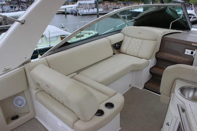 Slide: The Image of Luxurious interior of 2018 Regal 33 Express yacht with beige seating and modern amenities. - 8