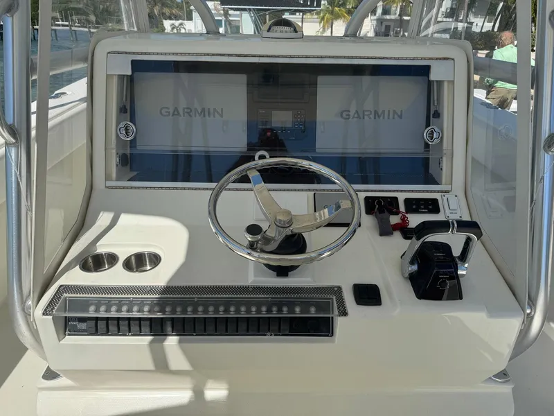 Slide: The Image of 2014 SeaVee 390B Center Console helm with Garmin displays and steering wheel. - 27