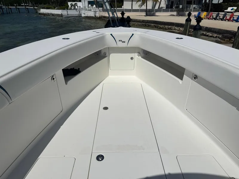 Slide: The Image of 2014 SeaVee 390B Center Console boat interior, featuring spacious deck and storage compartments. - 8