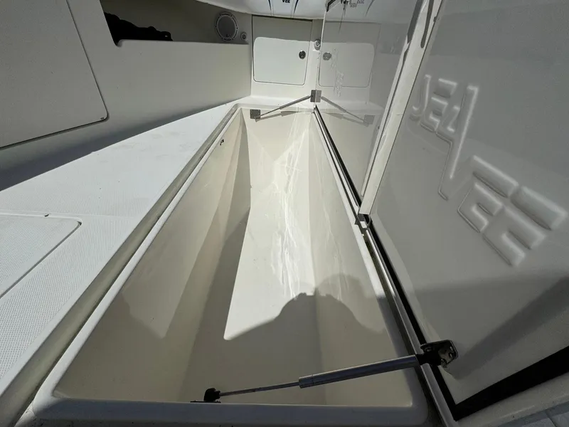 Slide: The Image of 2014 SeaVee 390B Center Console storage compartment, open and spacious interior view. - 9
