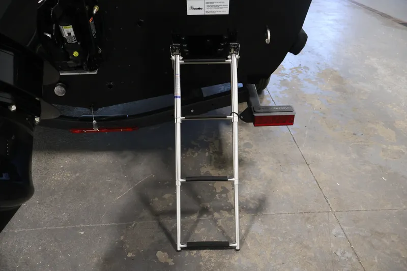 Slide: The Image of Rear view of 2027 Crestliner 1650 HAWK SC boat with ladder extended. - 39