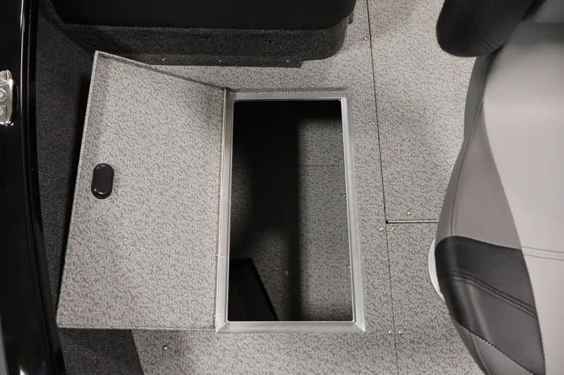 Slide: The Image of 2027 Crestliner 1650 HAWK SC boat interior storage compartment with open hatch. - 20