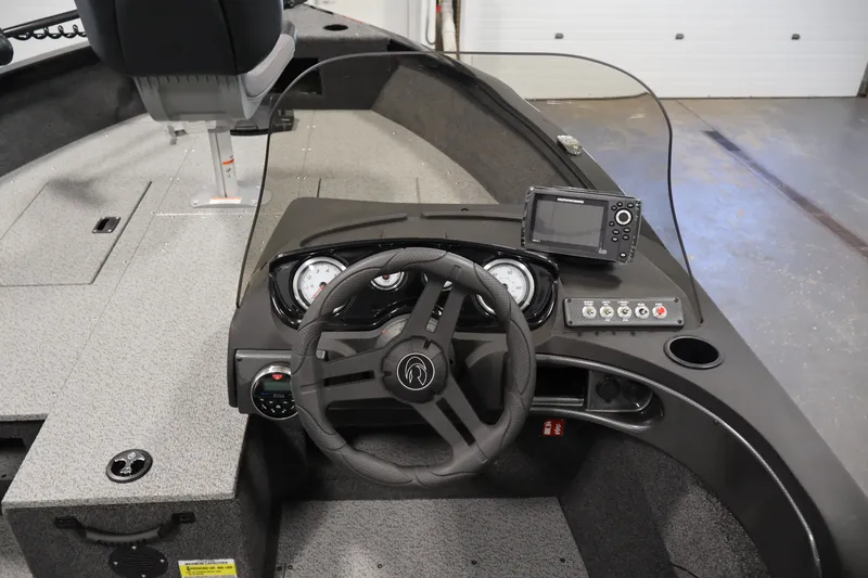 Slide: The Image of 2027 Crestliner 1650 HAWK SC boat dashboard with steering wheel and navigation system. - 26
