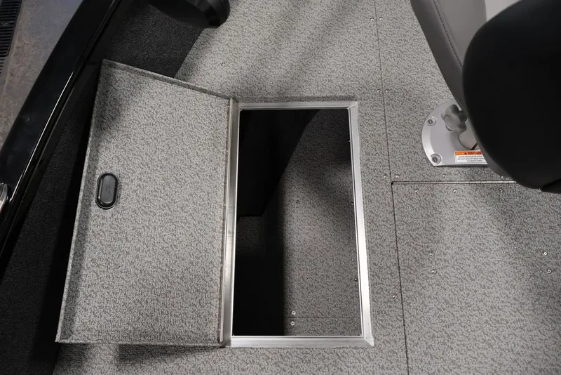 Slide: The Image of Open storage compartment on 2027 Crestliner 1650 Hawk SC boat floor. - 20