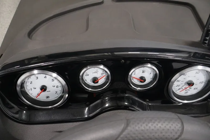 Slide: The Image of Dashboard of 2027 Crestliner 1650 Hawk SC boat with gauges and controls. - 26