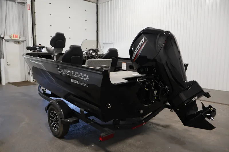 Slide: The Image of 2027 Crestliner 1650 HAWK SC boat with Mercury engine in a garage setting. - 11
