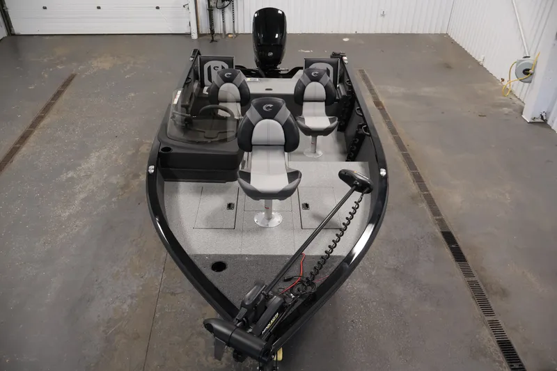 Slide: The Image of 2027 Crestliner 1650 HAWK SC fishing boat with four seats in a garage setting. - 13