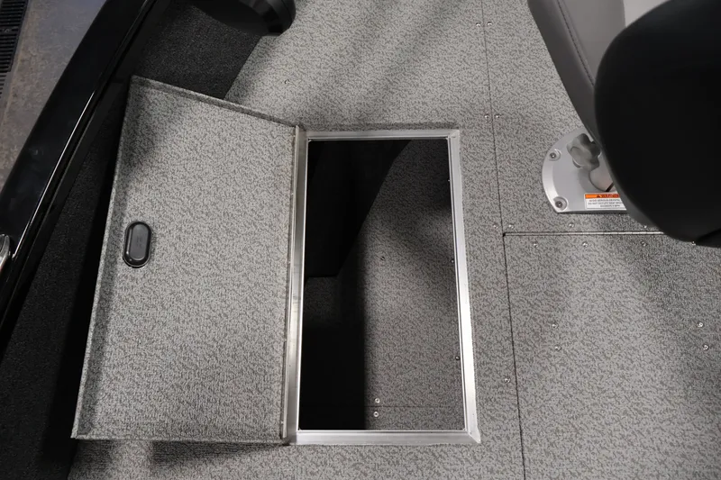Slide: The Image of Open storage compartment on 2027 Crestliner 1650 HAWK SC boat interior. - 21