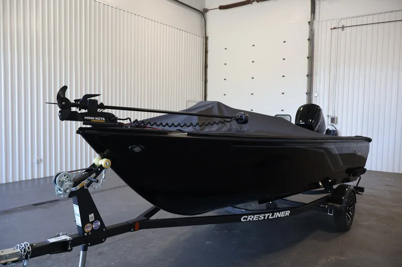 Slide: The Image of 2027 Crestliner 1650 HAWK SC boat in a garage, covered and on a trailer. - 40