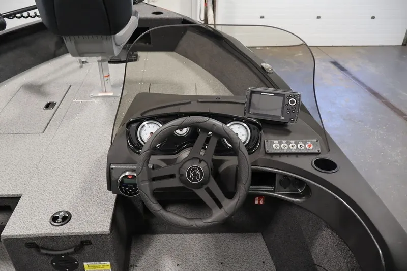 Slide: The Image of 2027 Crestliner 1650 Hawk SC boat dashboard with steering wheel and navigation system. - 31