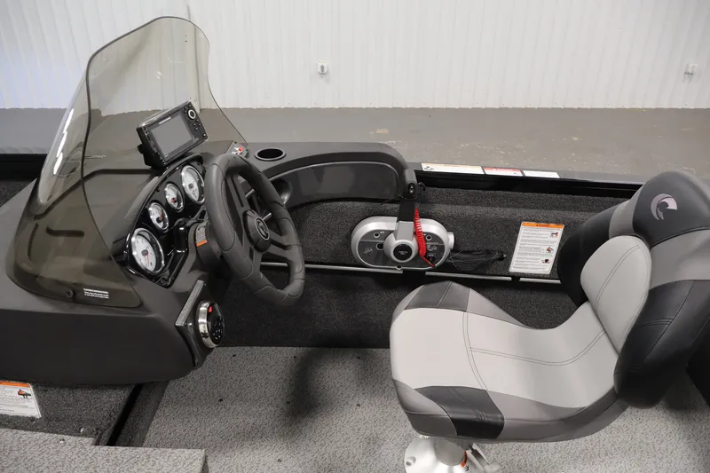 Slide: The Image of 2027 Crestliner 1650 HAWK SC boat interior with steering console and seat. - 25