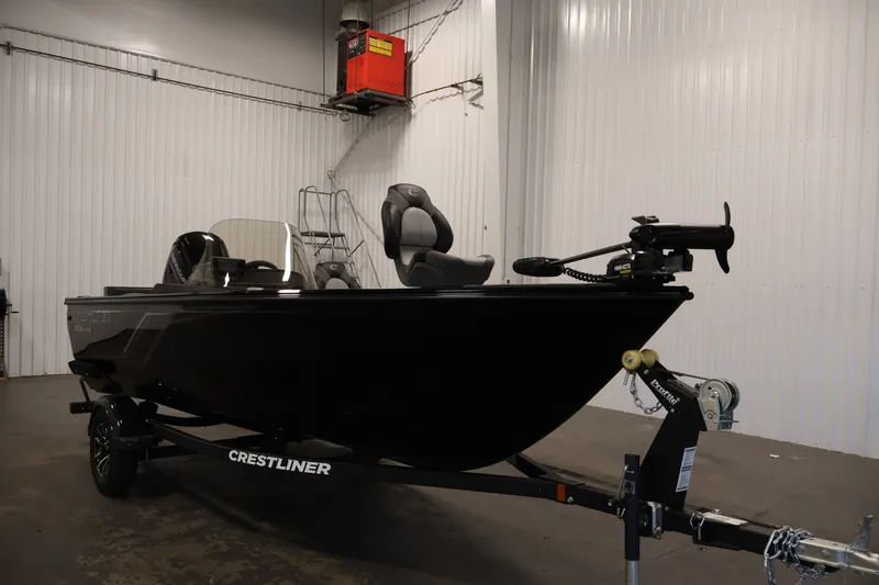 Slide: The Image of 2027 Crestliner 1650 HAWK SC fishing boat in a showroom, featuring sleek black design. - 7