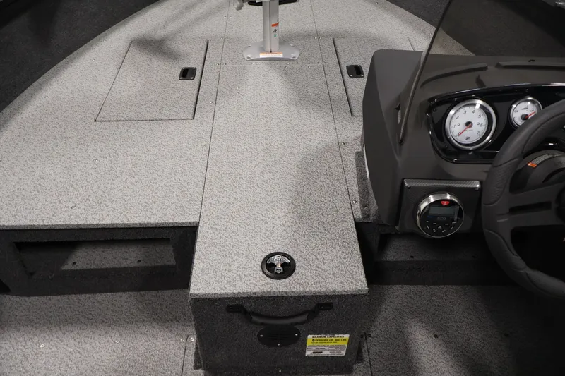 Slide: The Image of Interior view of 2027 Crestliner 1650 HAWK SC boat, featuring dashboard and seating area. - 22