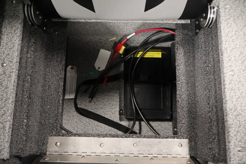 Slide: The Image of Battery compartment of 2027 Crestliner 1650 HAWK SC boat with wiring and secure straps. - 36