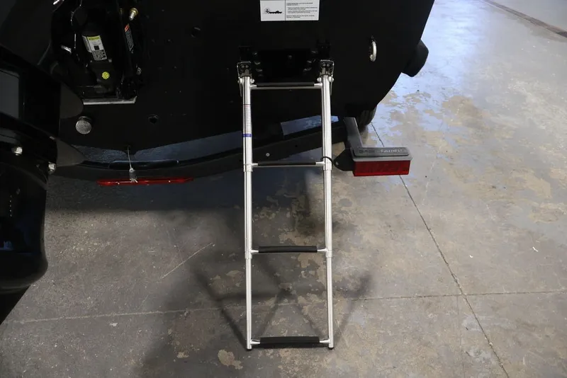 Slide: The Image of Rear view of 2027 Crestliner 1650 Hawk SC with ladder extended on concrete floor. - 38
