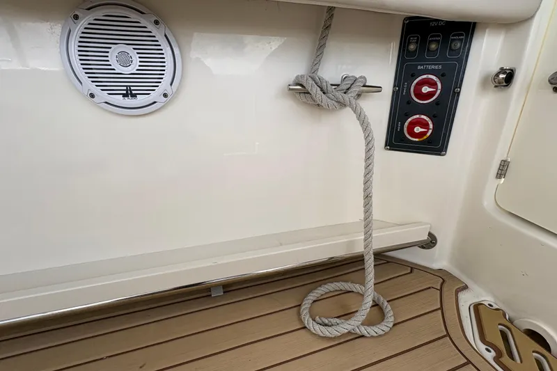 Slide: The Image of Interior of a 2017 Boston Whaler 270 Vantage boat with speaker and battery controls. - 14