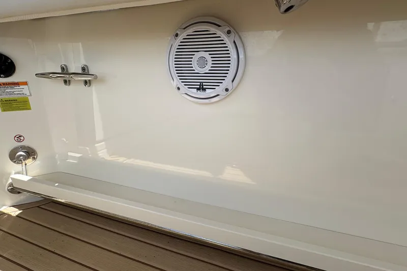 Slide: The Image of Interior view of a 2017 Boston Whaler 270 Vantage boat, featuring a speaker and cleat. - 16