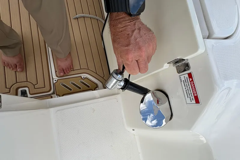 Slide: The Image of Hand freshwater shower on 2017 Boston Whaler 270 Vantage boat deck. - 19