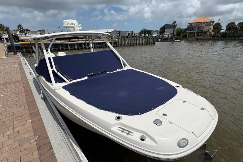 Slide: The Image of 2017 Boston Whaler 270 Vantage docked, featuring a sleek design and blue cover. - 43