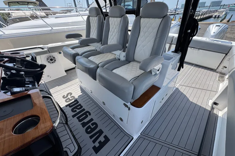 Slide: The Image of Luxurious seating on 2022 Everglades 395 Center Console boat, featuring elegant design and spacious layout. - 23