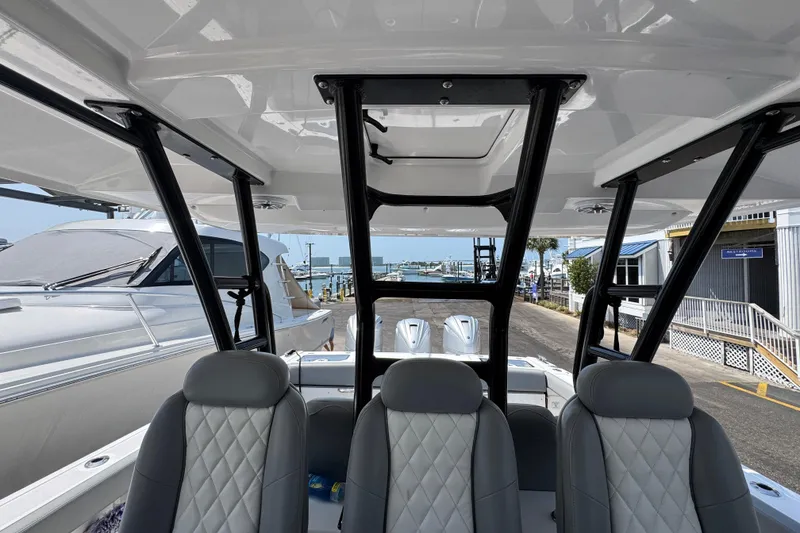 Slide: The Image of Interior view of 2022 Everglades 395 Center Console boat at marina. - 25