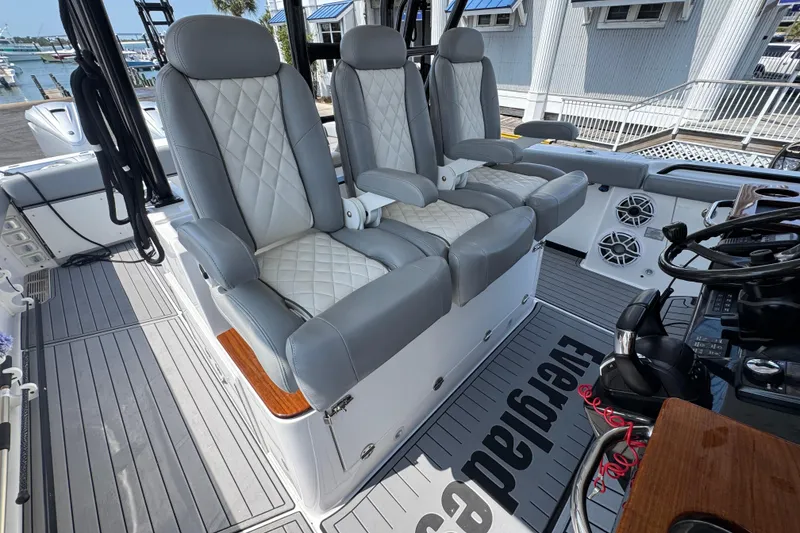 Slide: The Image of Luxury seating on 2022 Everglades 395 Center Console boat, featuring premium upholstery and modern design. - 26