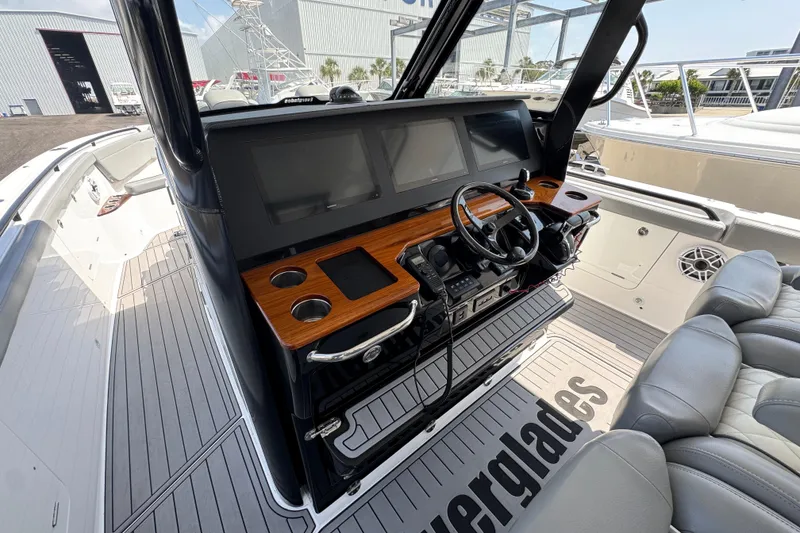 Slide: The Image of 2022 Everglades 395 Center Console boat interior with modern helm and seating. - 27