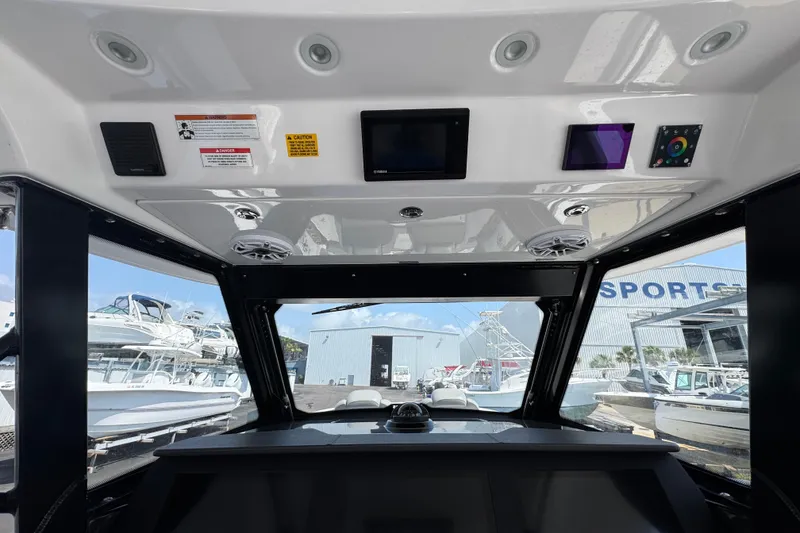 Slide: The Image of Interior view of 2022 Everglades 395 Center Console boat dashboard and controls. - 30