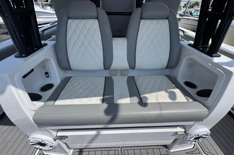 Slide: The Image of Luxury seating on 2022 Everglades 395 Center Console boat, featuring quilted upholstery. - 33